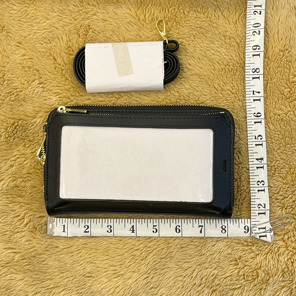 New Wallet Crossbody strap can lengthen to 43 inches.